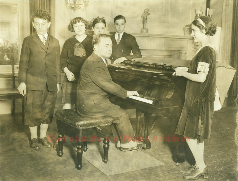 Josef Hofmann at the piano with students