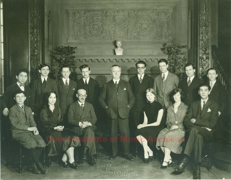 Carl Flesch and Richard Hartzer with students, Common Room fireplace